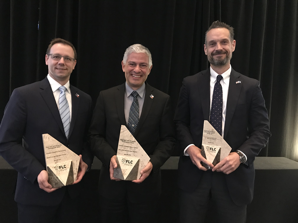 Jason Ford, Steven Gonzalez and Dan Lockney in Philadelphia accepting award. 